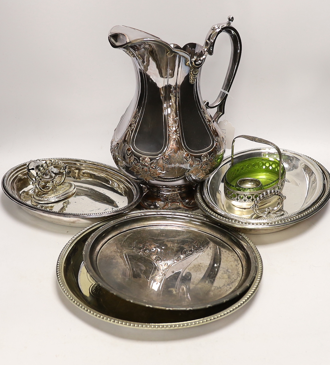 A small silver mustard pot and assorted plated wares including a large copper on electroplate jug, jug 30cm